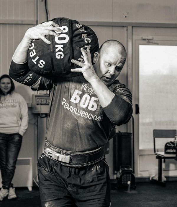 Man performing focused physical exercise in a modern environment